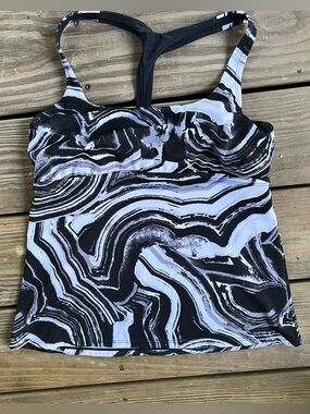 Nike Medium Surge Racerback Tankini. Stretchy for high-impact water activities.